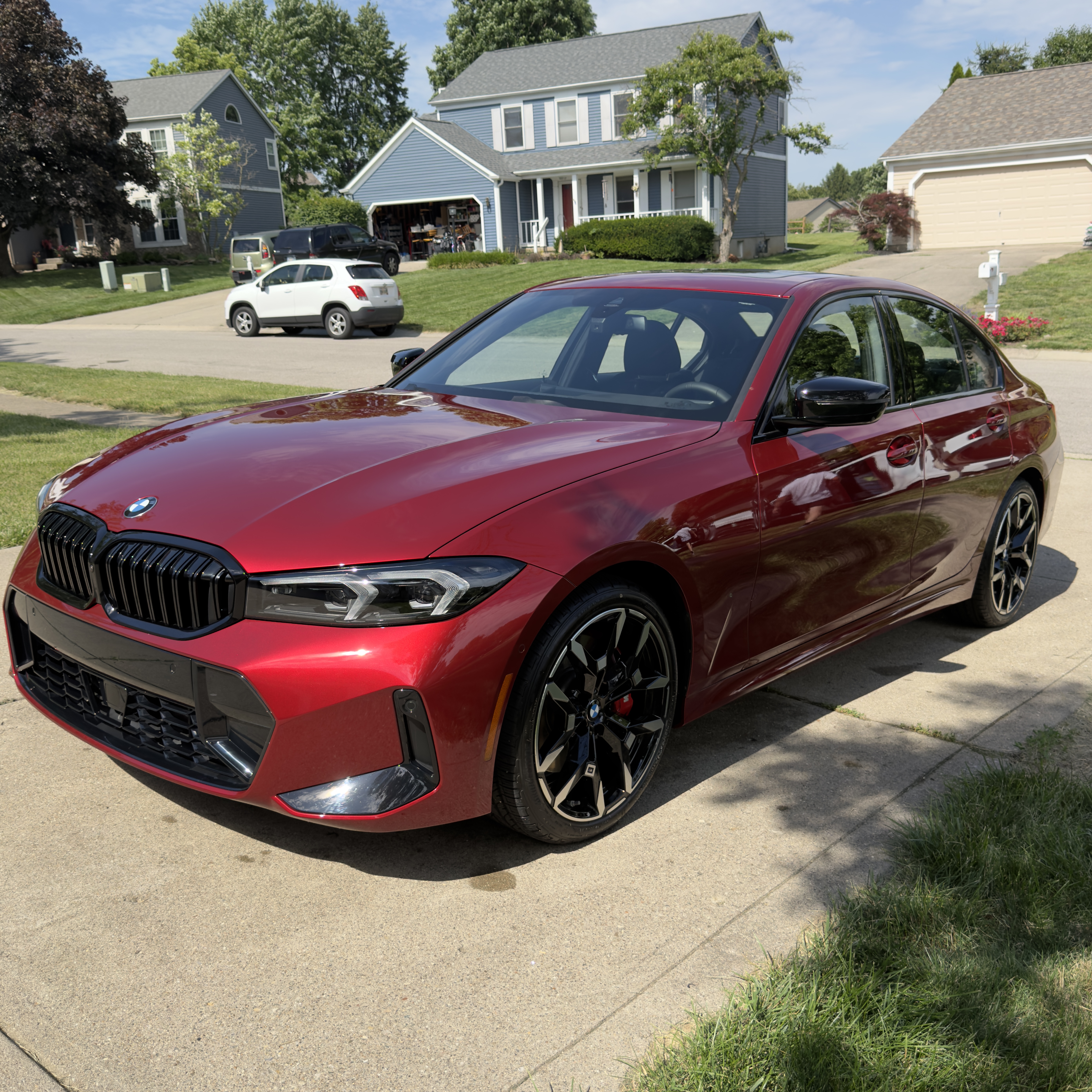 Red BMW 3 Series exterior after mobile detailing