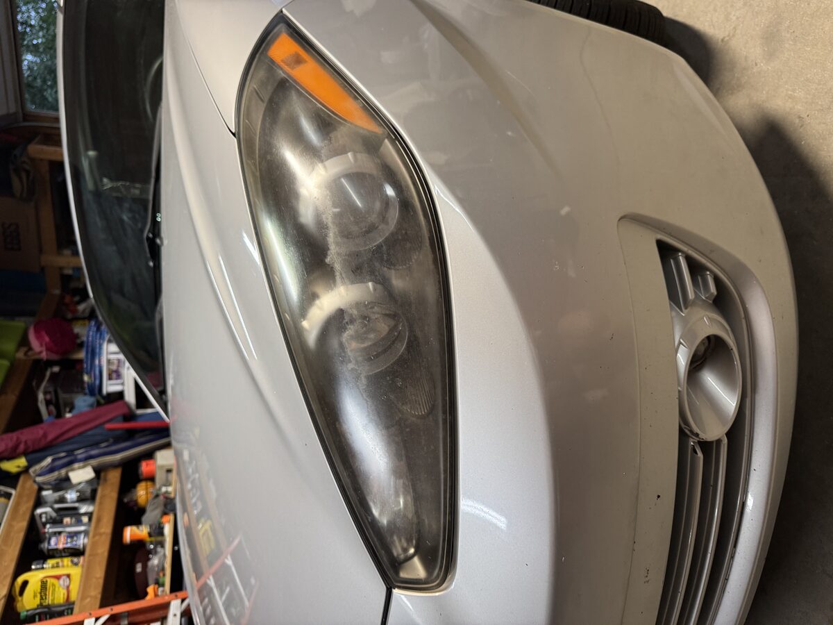 Foggy oxidized headlight before restoration by Perfect Touch Mobile Detailing